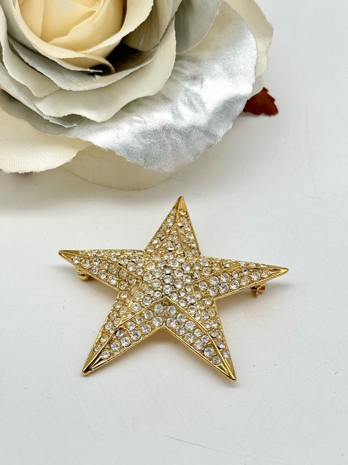 Vintage Joan Rivers Clear Rhinestone Gold Tone Star Brooch