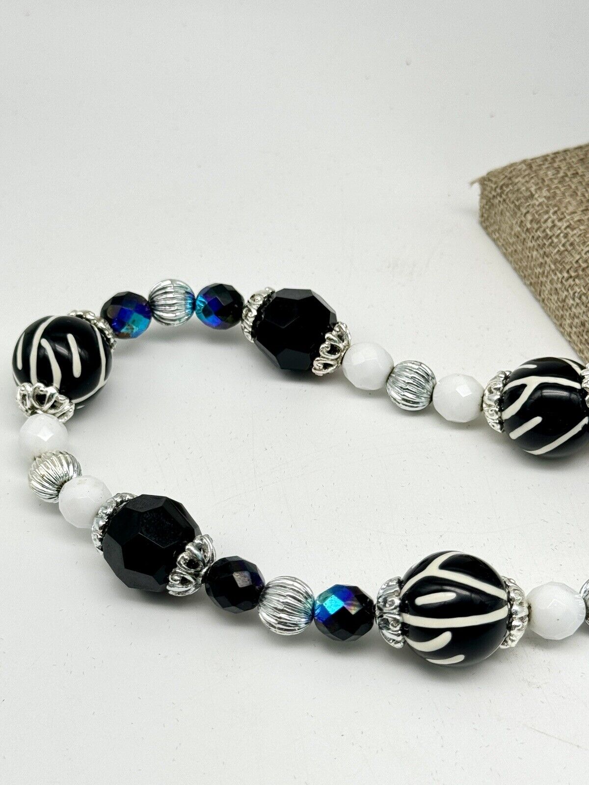 Joan Rivers Necklace 36" white black Zebra iridescent blue silver tones