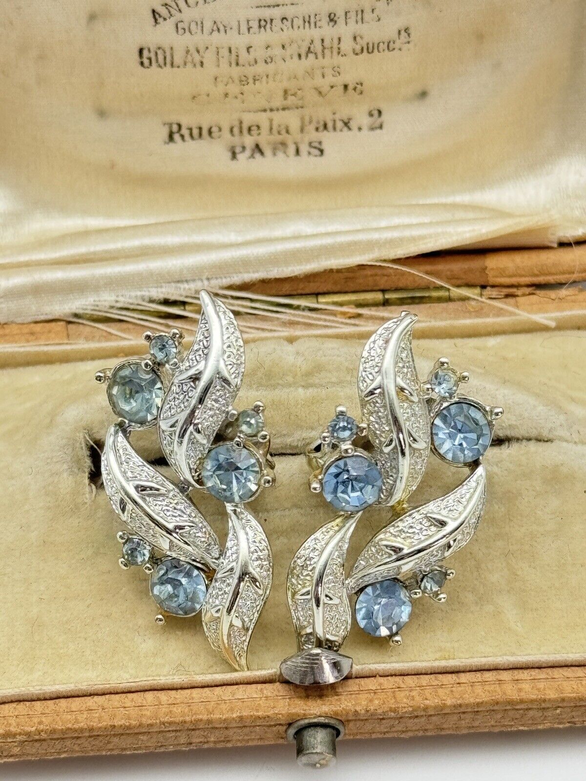 Vintage CORO Signed Earrings Silvertone Ice Blue Rhinestone Clip one