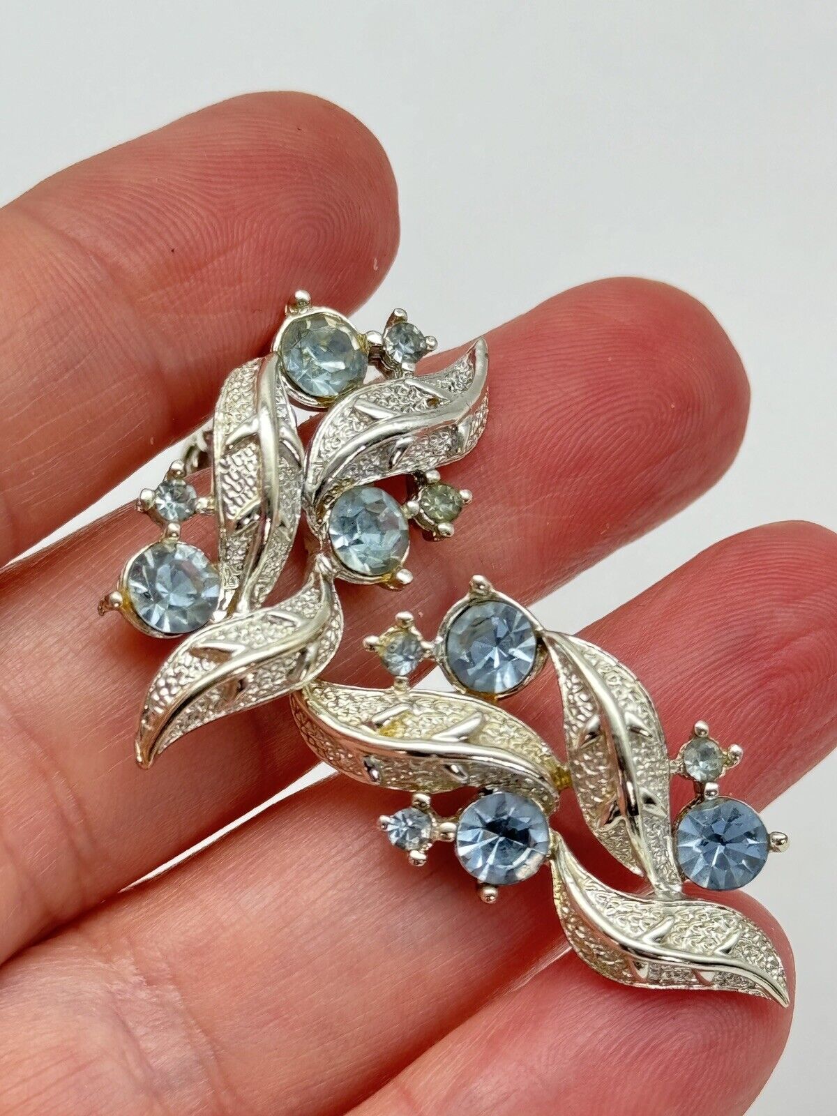 Vintage CORO Signed Earrings Silvertone Ice Blue Rhinestone Clip one