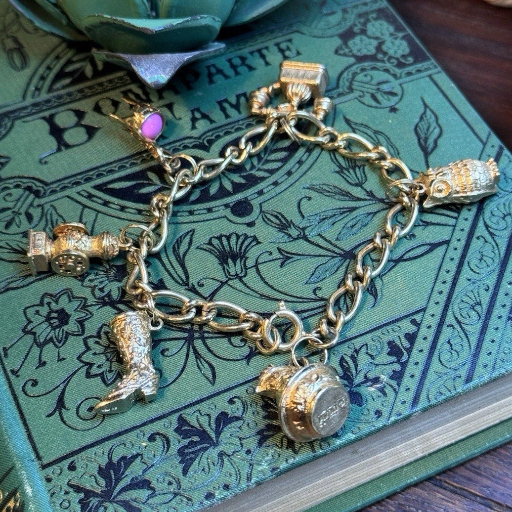 VINTAGE AVON CHARM BRACELET WITH 6 CHARMS HEAVY MARKED AVON 7" L