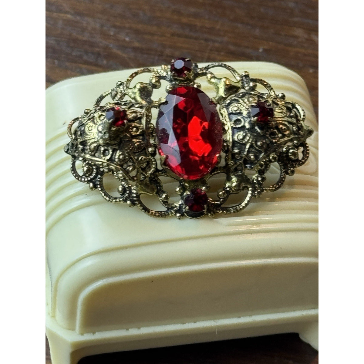 Red Rhinestone Brooch Filigree Goldtone Ornate 1 5/8” x 1”