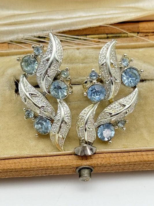 Vintage CORO Signed Earrings Silvertone Ice Blue Rhinestone Clip one