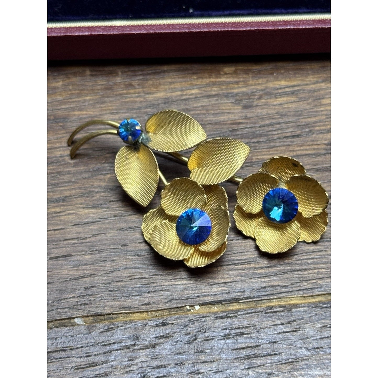 Vintage Goldtone Blue Rhinestone Flower Brooch Textured Floral Pin 2.5”