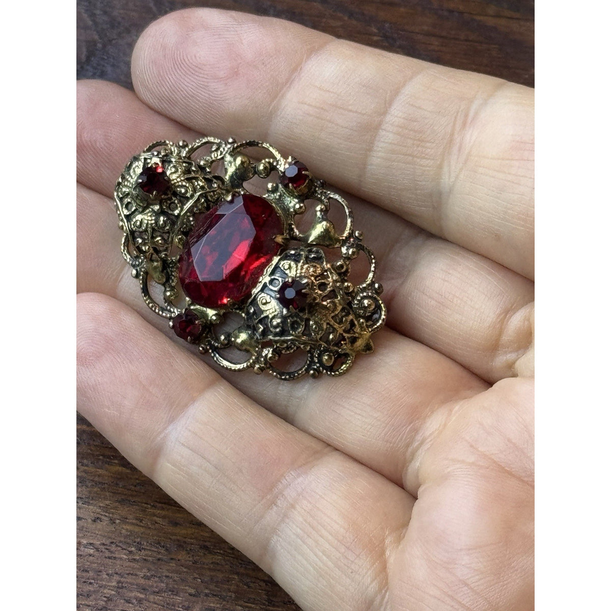 Red Rhinestone Brooch Filigree Goldtone Ornate 1 5/8” x 1”