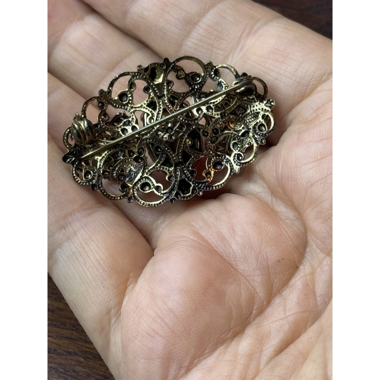 Red Rhinestone Brooch Filigree Goldtone Ornate 1 5/8” x 1”