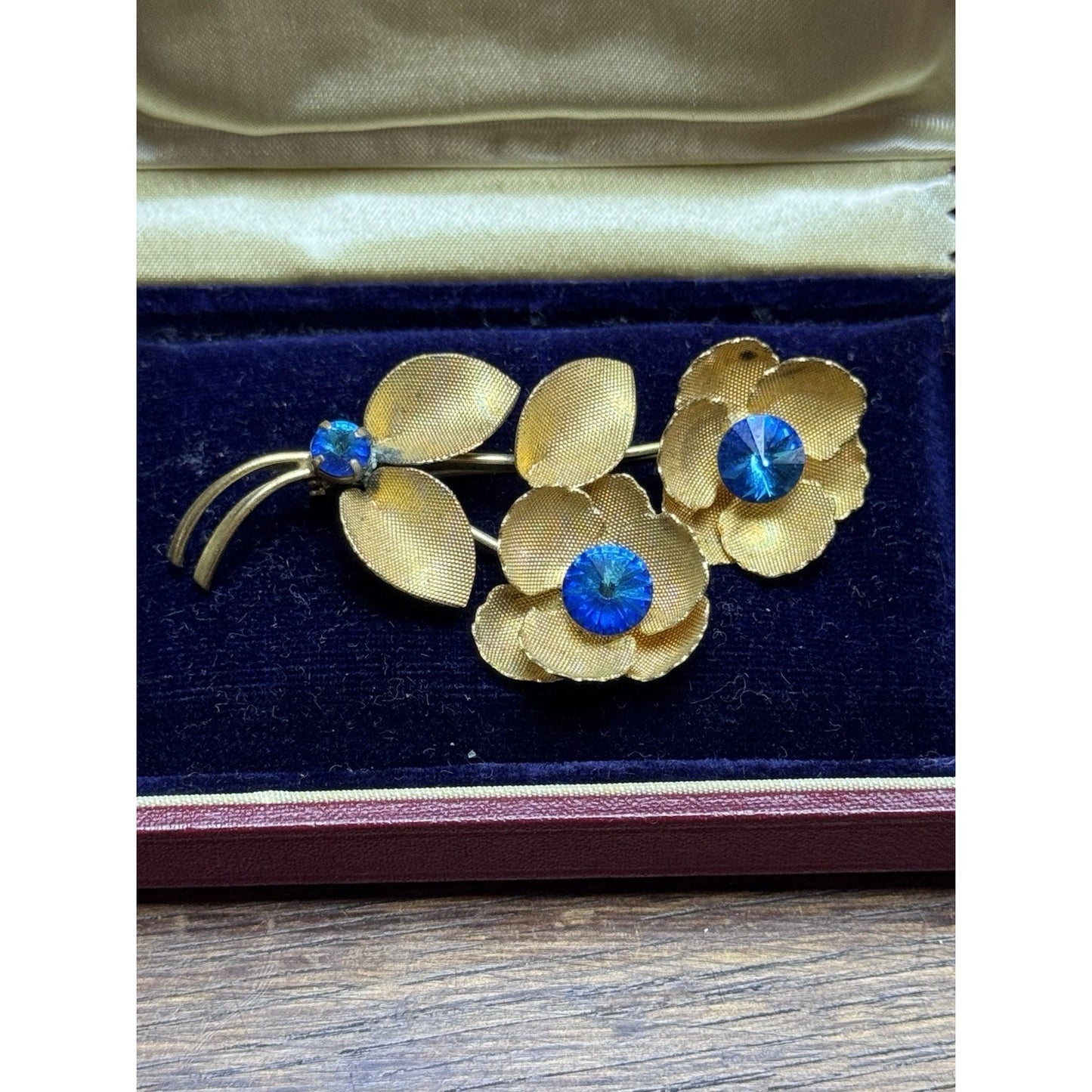 Vintage Goldtone Blue Rhinestone Flower Brooch Textured Floral Pin 2.5”