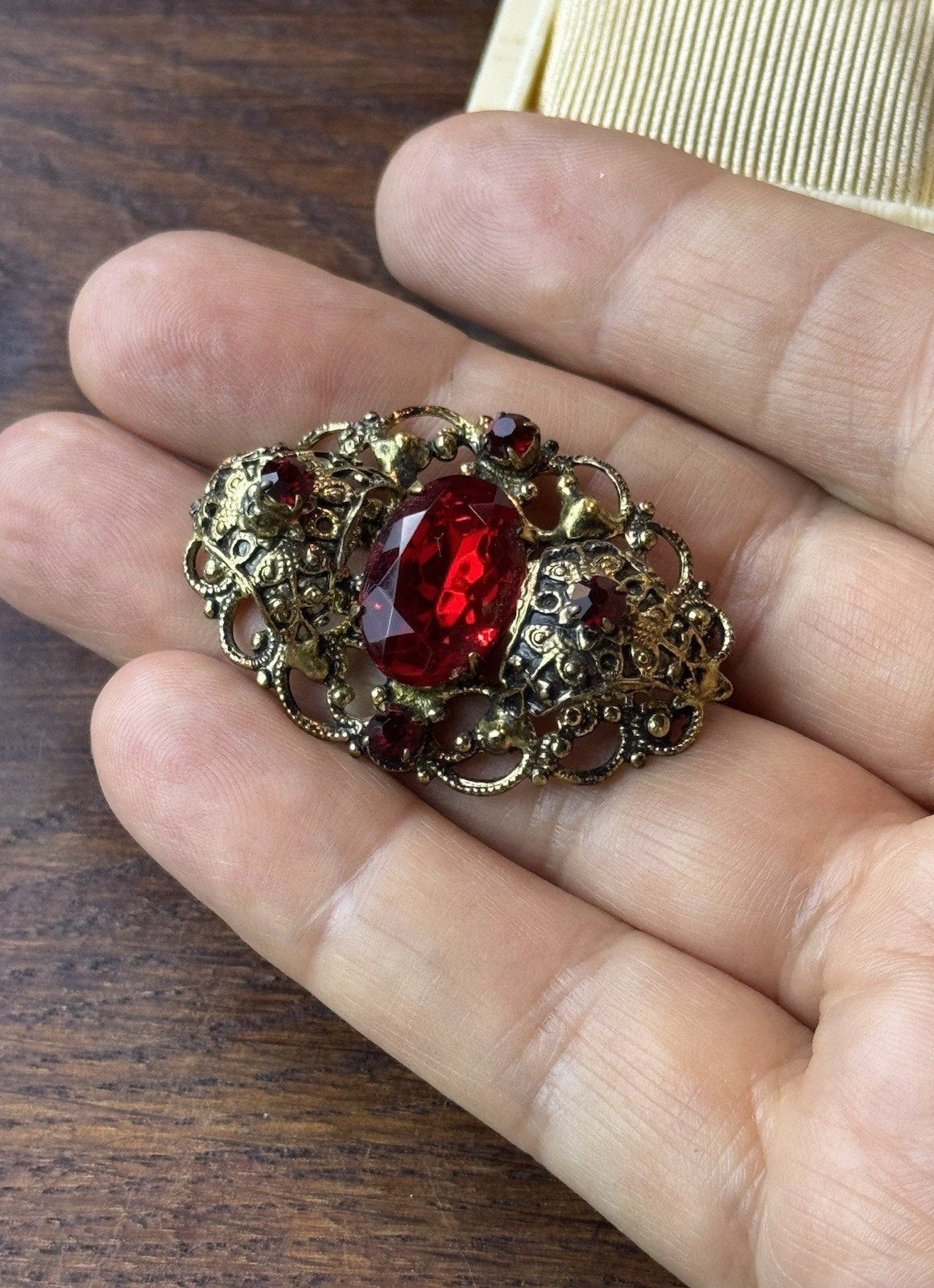 Red Rhinestone Brooch Filigree Goldtone Ornate 1 5/8” x 1”