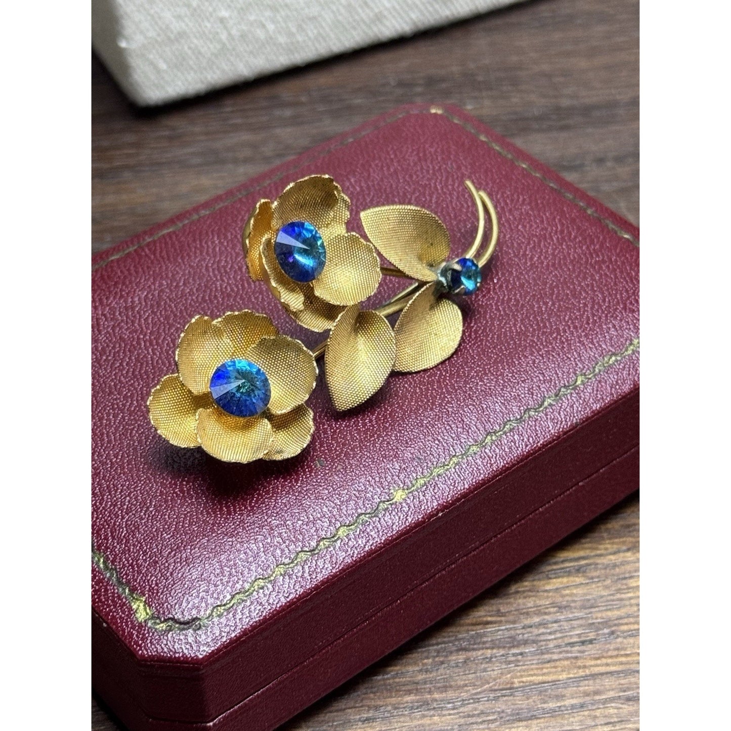 Vintage Goldtone Blue Rhinestone Flower Brooch Textured Floral Pin 2.5”