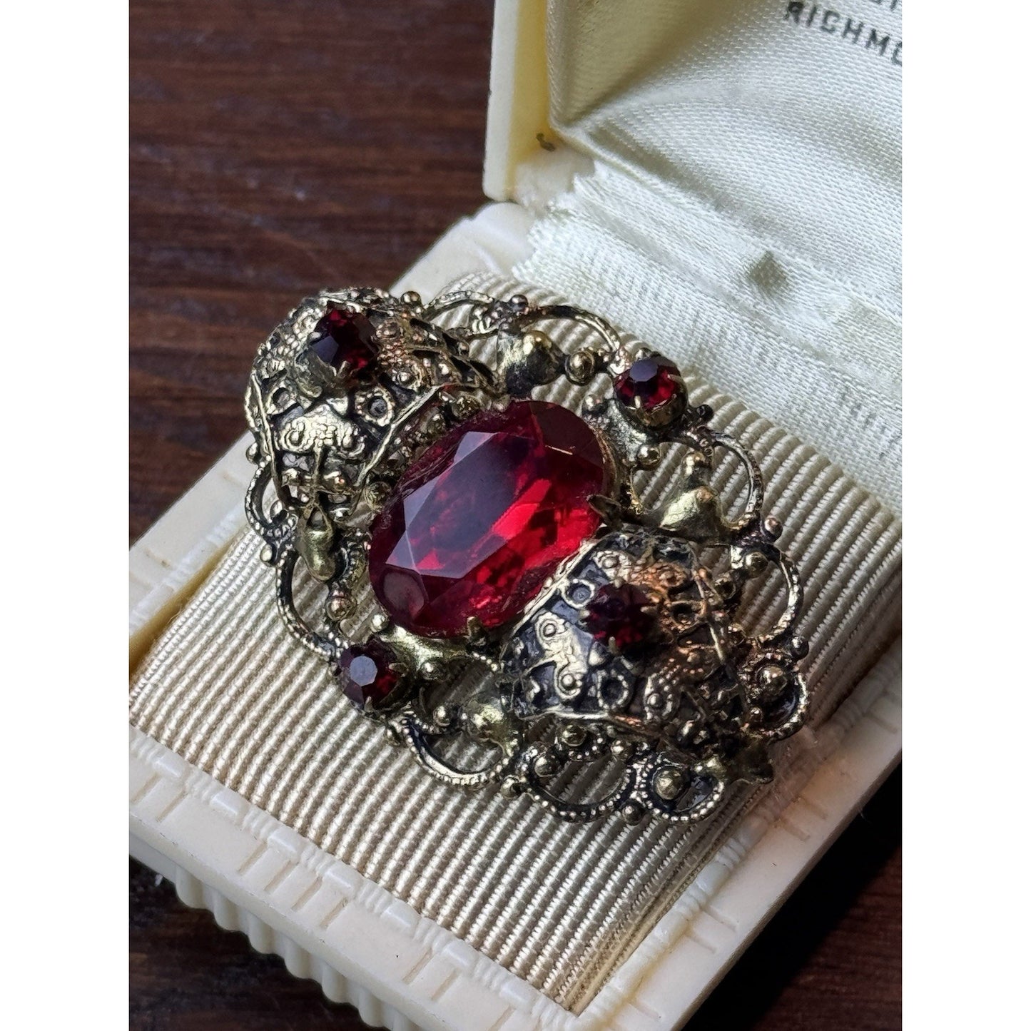 Red Rhinestone Brooch Filigree Goldtone Ornate 1 5/8” x 1”