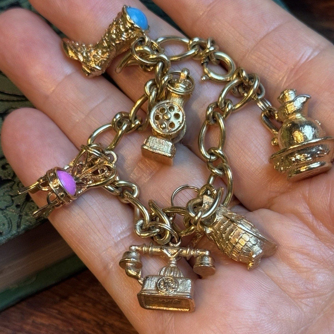 VINTAGE AVON CHARM BRACELET WITH 6 CHARMS HEAVY MARKED AVON 7" L