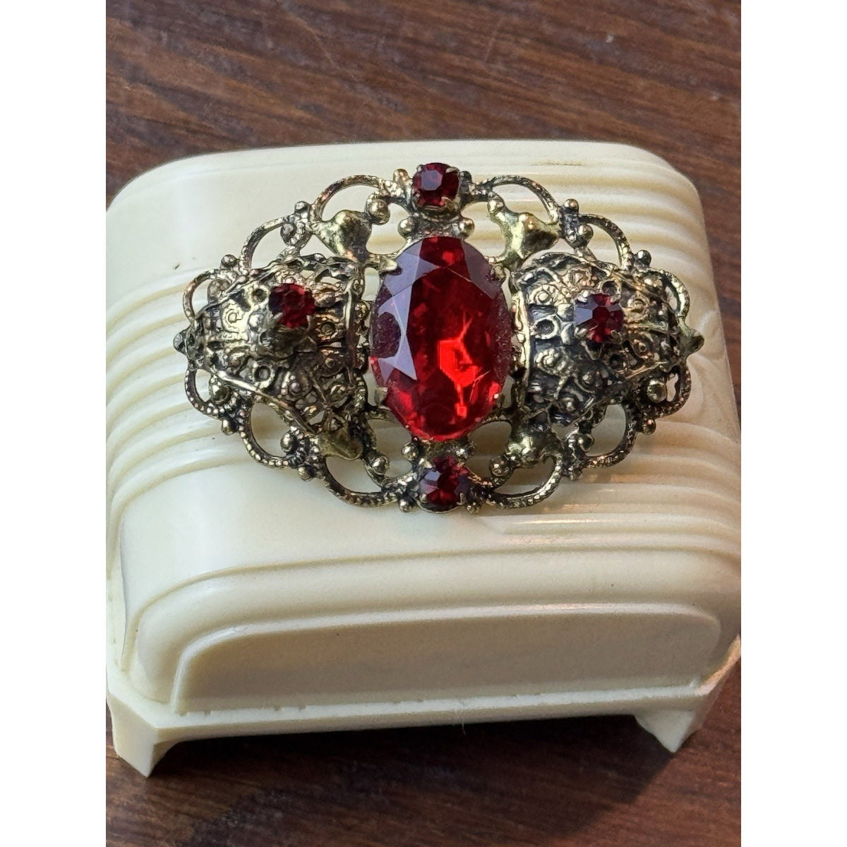 Red Rhinestone Brooch Filigree Goldtone Ornate 1 5/8” x 1”
