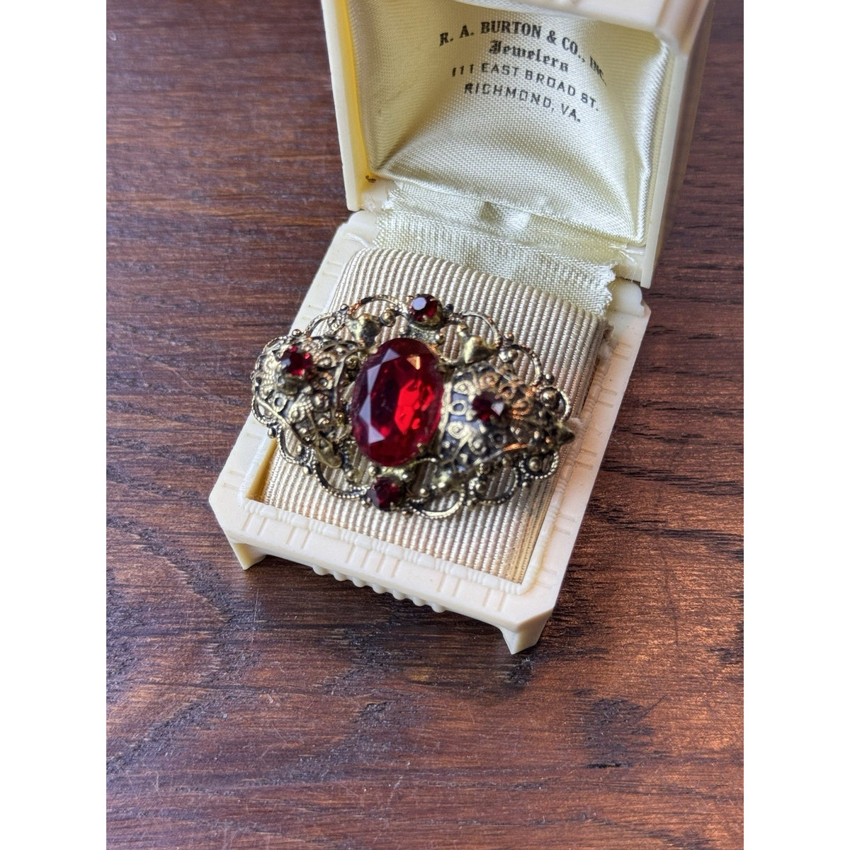 Red Rhinestone Brooch Filigree Goldtone Ornate 1 5/8” x 1”