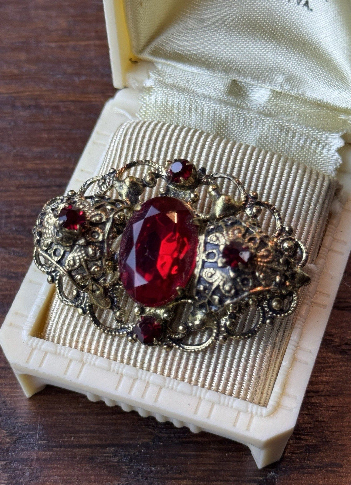 Red Rhinestone Brooch Filigree Goldtone Ornate 1 5/8” x 1”