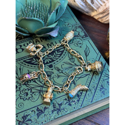 VINTAGE AVON CHARM BRACELET WITH 6 CHARMS HEAVY MARKED AVON 7" L
